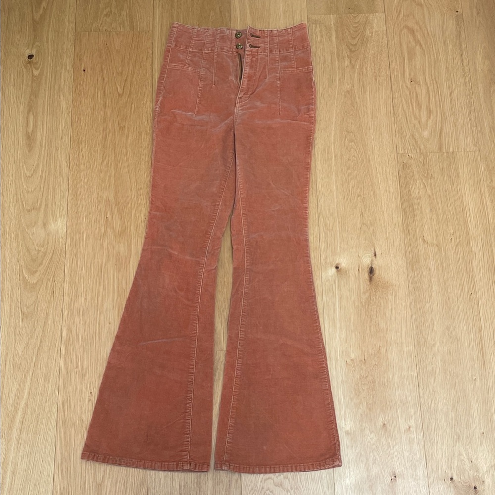 Free People Flare Jeans in Rust